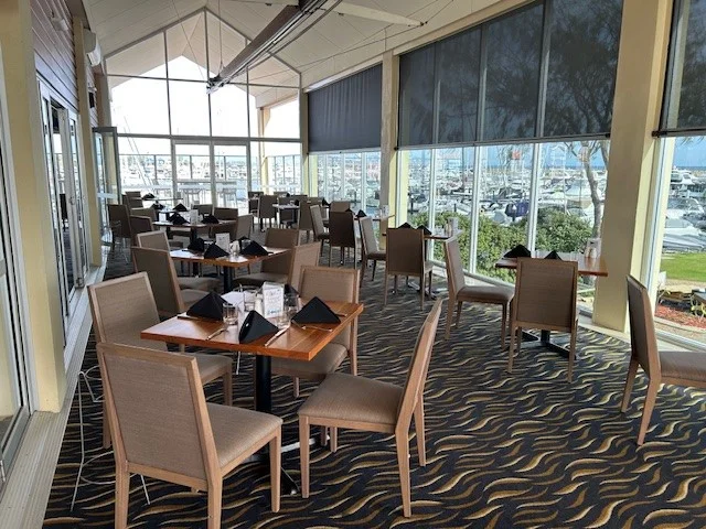 Custom Marri dining tables paired with Juniper commercial dining chairs in the Members Lounge at Hillarys Yacht Club.