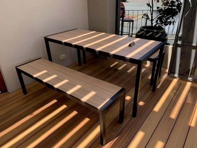 Alfresco dining setting at the Inglewood Hotel featuring Compact Laminate table tops and matching outdoor bench seating supplied by Robinson Group.