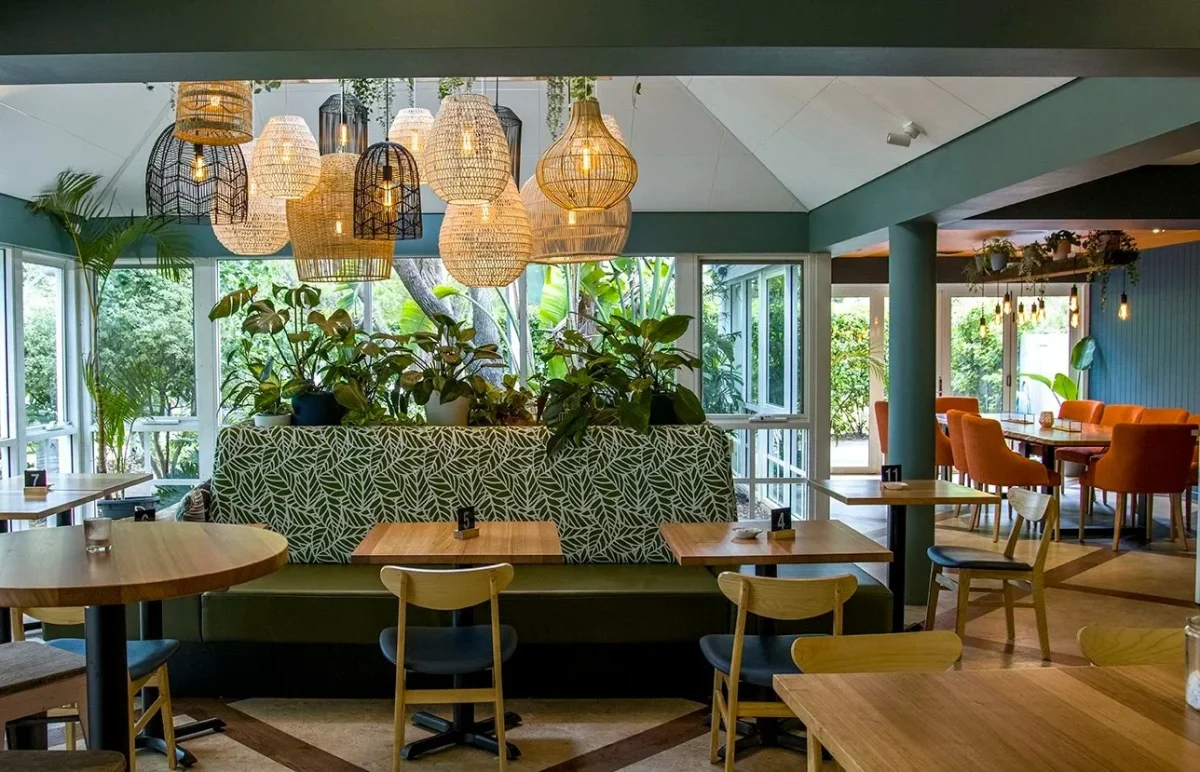 Interior of Tonic by the Bay in Busselton featuring Robinson Group’s custom upholstered booths, Chai Chairs, and solid timber tables, blending contemporary design with coastal warmth.